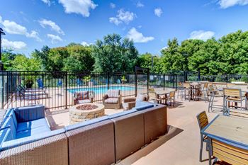 Outdoor Living Room with Pool and Alfresco Dining-Berkshire Central Apartments Blaine MN